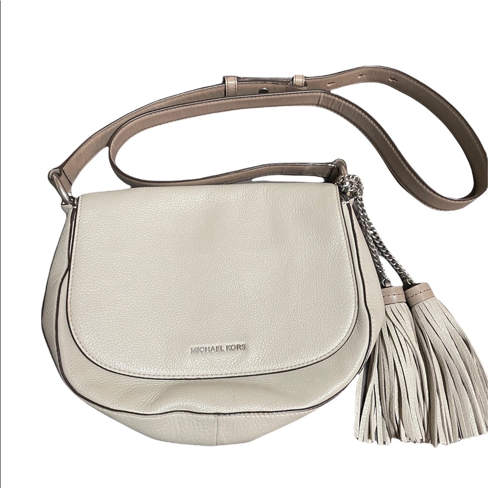 Leather cream shoulder bag with decorative tassels